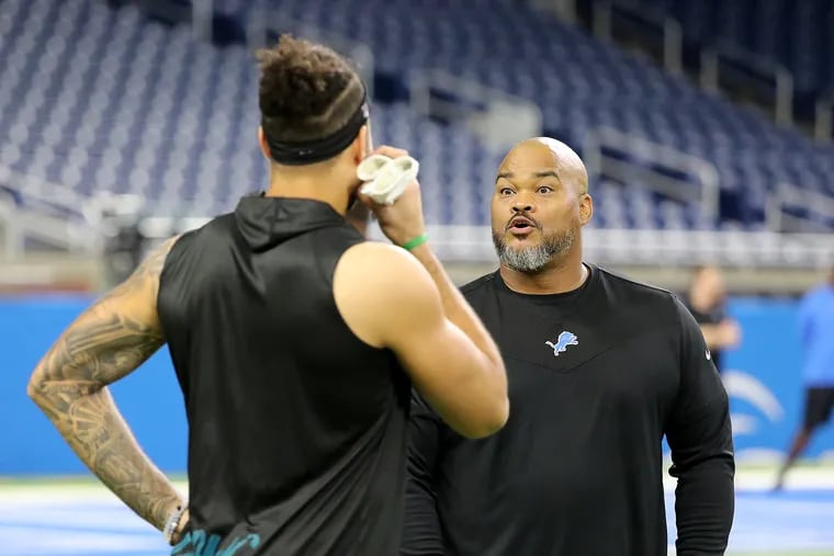 Philadelphia Eagles wide receiver J.J. Arcega-Whiteside (left) talks with former Eagle and new running backs coach for the Lions, Duce Staley (right) before the Eagles play the Detroit Lions at Ford Field in Detroit, Mich. on October 31, 2021.