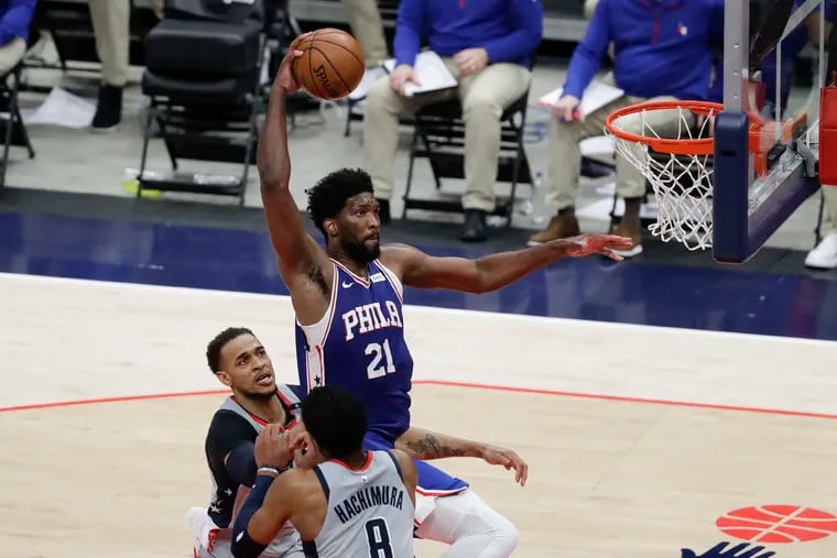 Sixers center Joel Embiid, shown here dropping the hammer in Game 3, played just 11 minutes before leaving Game 4 with right knee soreness.