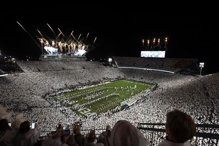Penn State takes the field for an NCAA college football game against Minnesota amidst a "Whiteout" crowd at Beaver Stadium in October.