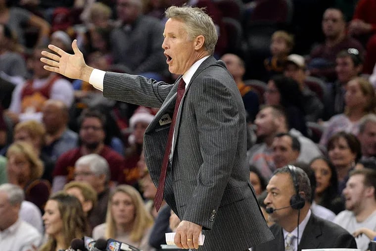 Philadelphia 76ers head coach Brett Brown calls to his team during the second half against the Cleveland Cavaliers at Quicken Loans Arena. The Cavs won 108-86.