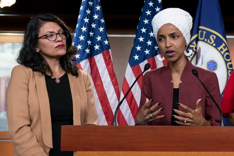 FILE - In this July 15, 2019, file photo, U.S. Rep. Ilhan Omar, D-Minn, right, speaks, as U.S. Rep. Rashida Tlaib, D-Mich. listens, during a news conference at the Capitol in Washington. The U.S. envoy to Israel said he supports Israel's decision to deny entry to two Muslim congresswomen ahead of their planned visit to Jerusalem and the West Bank. Ambassador David Friedman said Thursday, Aug. 15, 2019, in a statement following the Israeli government's announcement that Israel "has every right to protect its borders" against promoters of boycotts "in the same manner as it would bar entrants with more conventional weapons."