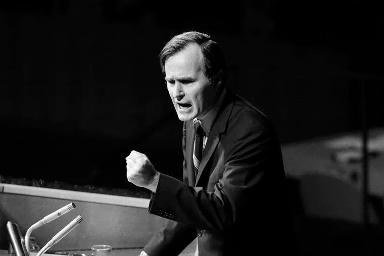 In this Oct. 18, 1971, file photo, U.S. Ambassador George H.W. Bush gestures as he addresses the United Nations General Assembly during the China debate. He denied the U.S. formula was either a "Two Chinas" or a "One China and one Taiwan" plan.
