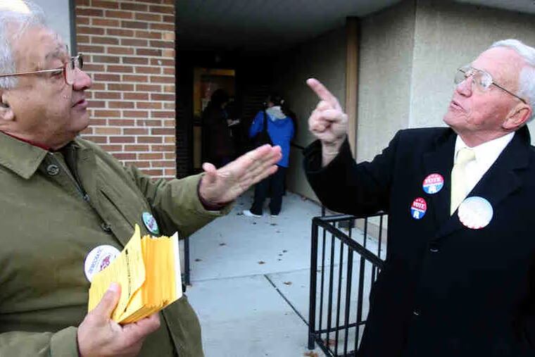 Bill Saba (left), a Democrat, and Ron Matlack, a Republican, have a &quot;friendly&quot; disagreement at a Bucks County polling place.