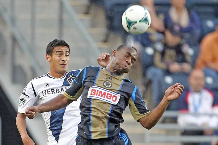 Philadelphia Union's Amobi Okugo, right, heads the ball against Los Angeles Galaxy's Jose Villarreal during the first half at PPL Park in Chester, Pennsylvania, Wednesday, May 15, 2013. (Yong Kim/Philadelphia Daily News/MCT)