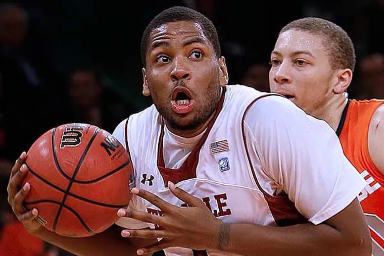 Temple's Khalif Wyatt looks to shoot after driving past Syracuse's Brandon Triche, right, during the first half of an NCAA college basketball game in the Gotham Classic tournament at Madison Square Garden, Saturday, Dec. 22, 2012, in New York. (Jason Decrow/AP)