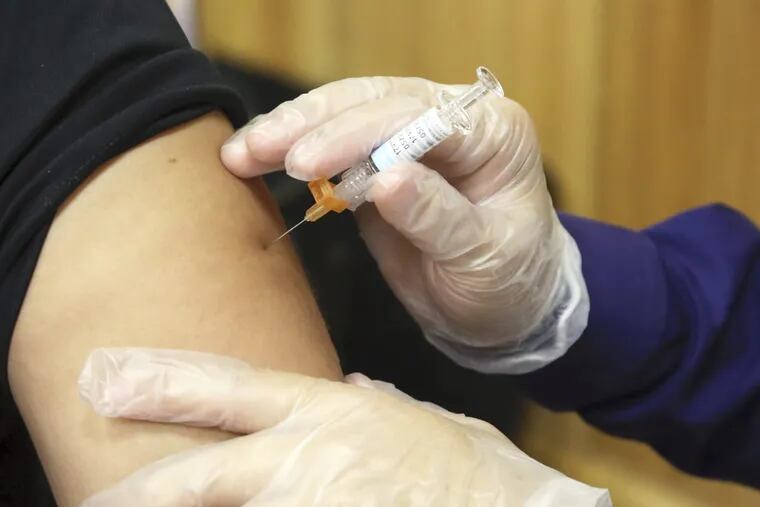 Flu shots are encouraged for most people, such as this patient in Brownsville, Texas, but new data show that sometimes doctors and nurses do not follow the advice.