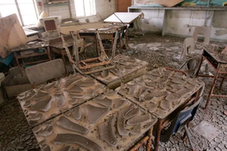 Dried mud still cakes a classroom at Joseph A. Hardin Elementary School in New Orleans. At right, Paul Vallas is introduced at the city&#0039;s Martin Luther King School as the new superintendent of the hurricane-ravaged Recovery School District. Vallas has headed Philadelphia schools since 2002.