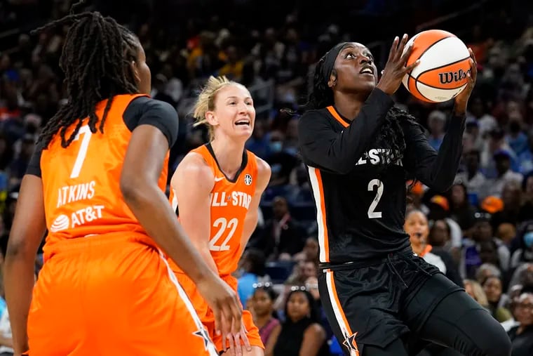North Philadelphia's Kahleah Copper (right) drives to the basket during the first half of Sunday's WNBA All-Star Game in Chicago.