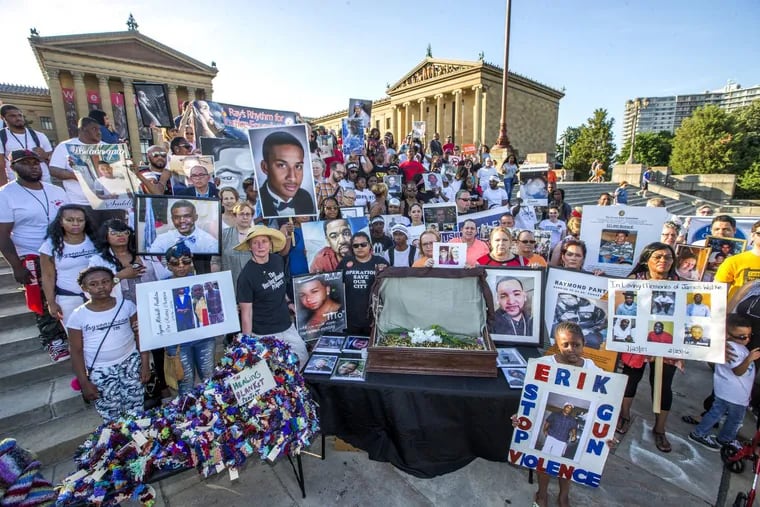 Relatives and friends of the victims of gun violence stand on the Art Museum steps on June 15, 2017. CHARLES FOX / Staff Photographer