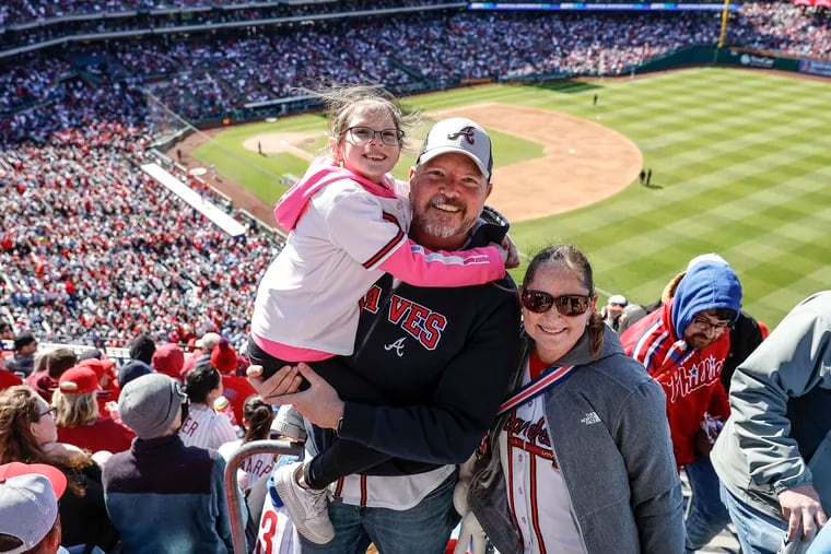Jeff and Alison Donovan, of Orlando Fla., with daughter Emily, at Citizens Bank Park for the Phillies-Braves season opener. They're big Braves fans who never like to miss opening day. They were surprised Philadelphia didn't have more venues for pre- and post-gaming.