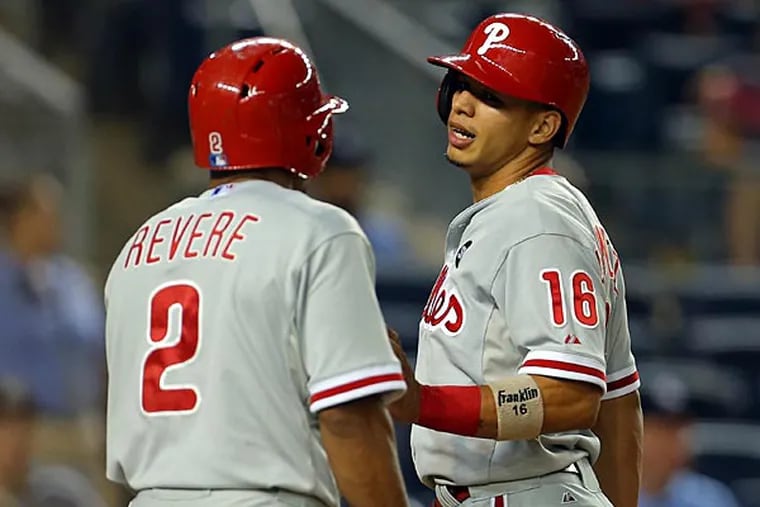 Philadelphia Phillies second baseman Cesar Hernandez (16) and left fielder Ben Revere (2) celebrate after scoring against the New York Yankees during the ninth inning of an inter-league baseball game at Yankee Stadium. (Adam Hunger/USA Today)