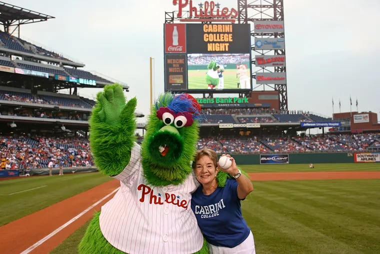 Dr. Iadarola with the Phillie Phanatic in a 2007 photo. She served as president of Cabrini University from 1992 to 2008.