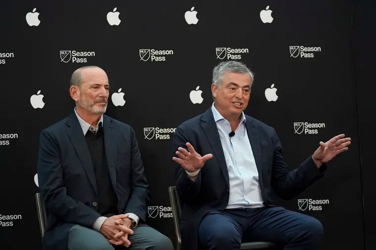 Apple senior vice president of services Eddy Cue (right) with Major League Soccer commissioner Don Garber in January.