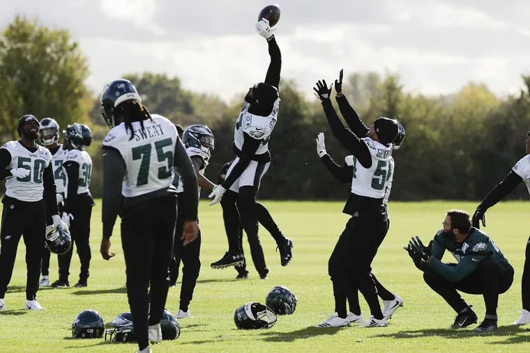 Eagles strong safety Malcolm Jenkins tips the football before the team practiced at the London Irish training ground in Southwest London on Friday, October 26, 2018. YONG KIM / Staff Photographer