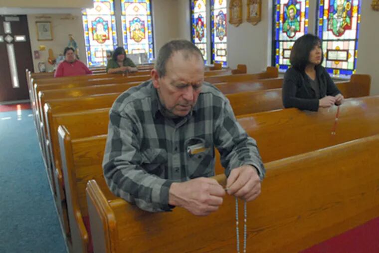 Closed by the Camden Diocese, St. Mary's in the Malaga section of Franklin Township continues to draw worshipers such as Joe Podsiadlo of Elmer, N.J. (April Saul / Staff Photographer)