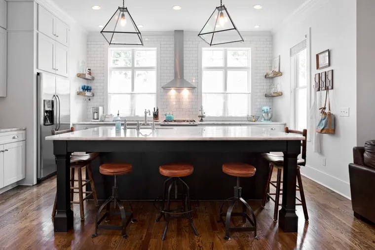A full-height backsplash can be a stylish focal point or a dramatic accent in a kitchen.