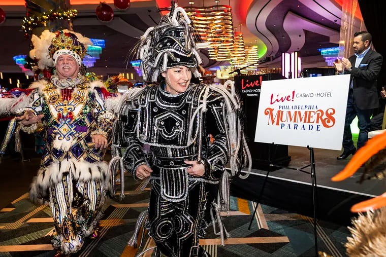 Kelliann Gallagher, captain of the Hegeman String Band, dances minutes after the Live! Casino on Wednesday announced its sponsorship for the Mummers Parade.