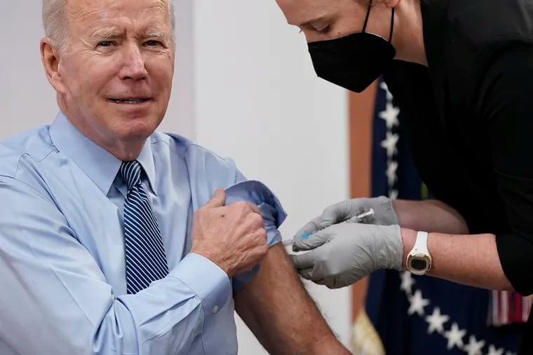 President Joe Biden receives his second COVID-19 booster shot in the South Court Auditorium on the White House campus, Wednesday, March 30, 2022, in Washington.