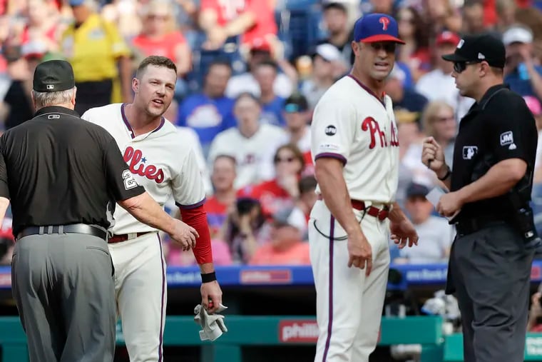 Rhys Hoskins was held back by first-base umpire Joe West after Hoskins got ejected, while manager Gabe Kapler talked to plate umpire Will Little during Hoskins' crippling second-half slump.