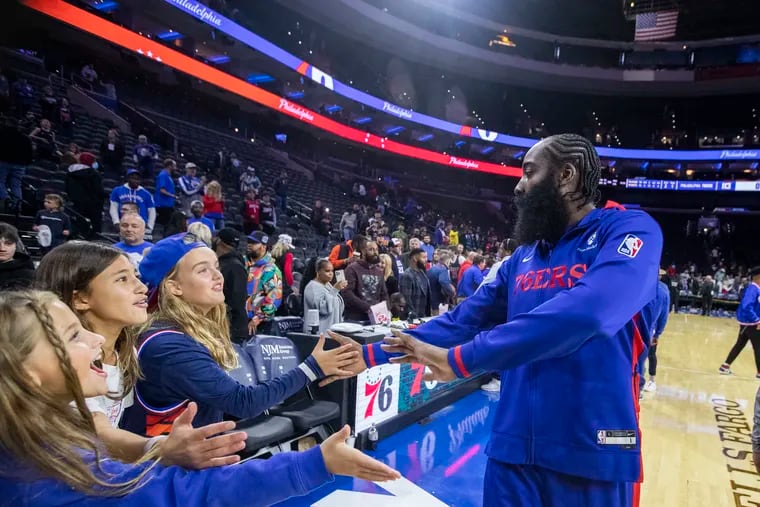 James Harden of the Sixers greeting some young fans after their preseason game at the Wells Fargo Center on Oct. 5.
