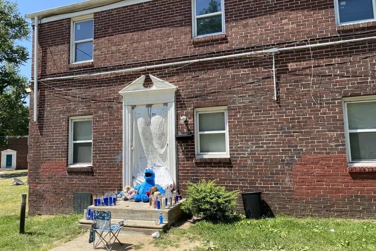 Stuffed animals, candles, and signs showing love in memory of 5-year-old Bryan Hence Jr., known as "BJ," decorate the outside of the second-floor apartment on Willow Walk, near the 2500 block of South Eighth Street in Camden, where the child lived. Authorities said he was fatally beaten by his mother and her boyfriend.