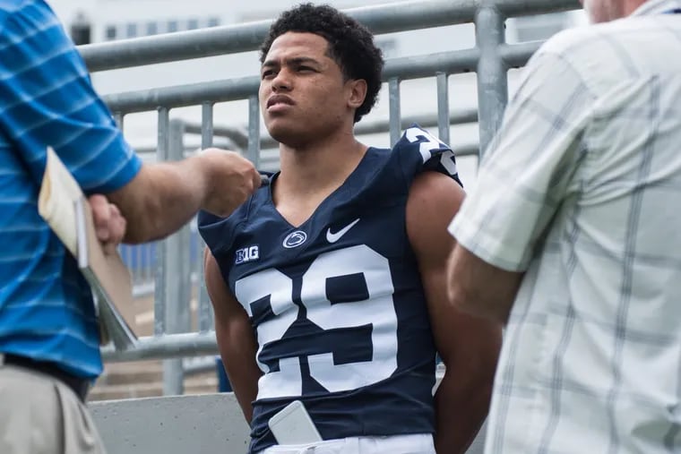 Penn State cornerback John Reid, here answering questions during Media Day last year, is an intern for Intel.