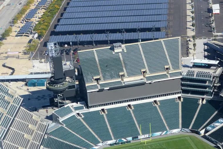 File. Aerial view of Lincoln Financial Field with solar panels covering parking lot.