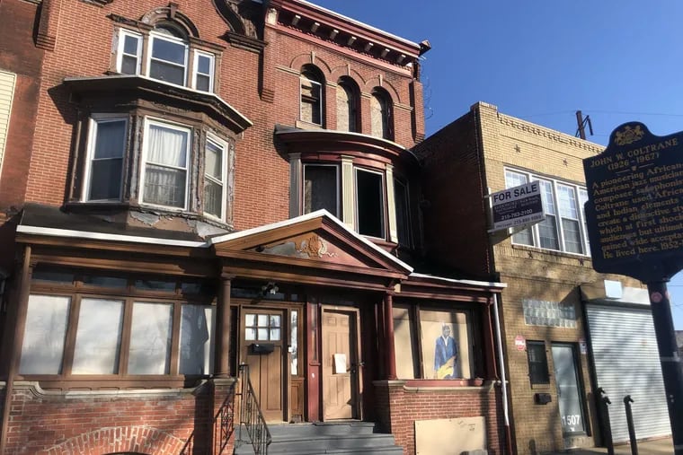 A developer has purchased 1509 N. 33rd Street, the house next to the one where jazz musician John Coltrane lived during his most productive period, and has requested permission to demolish building., which includes three arched windows on the third floor.