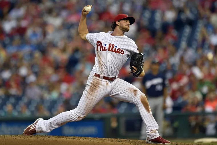 Phillies starting pitcher Aaron Nola throws during the third inning of the Phillies 6-1 lead over the Brewers.