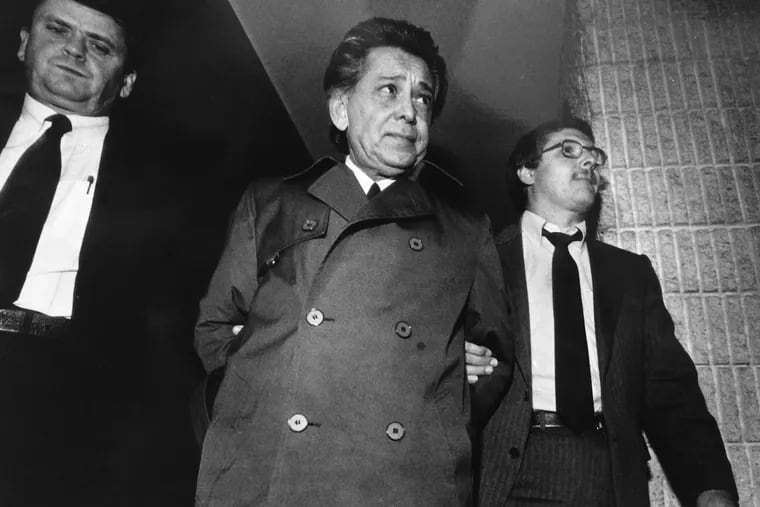 Nicodemo Scarfo (center) is escorted by federal agents at Atlantic City Airport in Pomona, N.J., on Jan. 7, 1984, after his arrest upon his return from a vacation in Fort Lauderdale, Florida.
