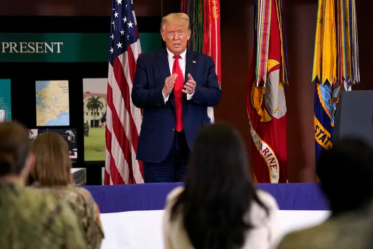 President Donald Trump claps after delivering a speech about the counternarcotics operations at U.S. Southern Command on Friday in Doral, Fla.