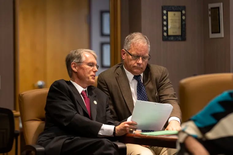 PSERS Investment Head James H. Grossman Jr., (left), and Christopher Santa Maria, Board Chairman, (right), converse during a short break during the PSERS investment committee meeting at the PSERS offices in Harrisburg, Pa., on Thursday, June 10, 2021.