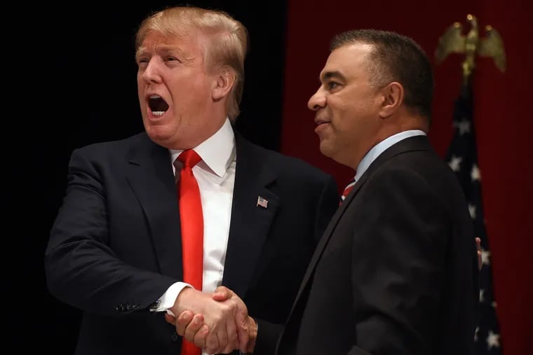 Then-candidate Donald Trump shakes hands with David Bossie, the president of Citizens United, during a campaign event in 2015. Bossie would later be hired as Trump's deputy campaign manager in 2016.