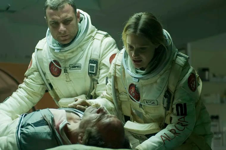Liev Schreiber and Romola Garai check on Elias Koteas in &quot;The Last Days on Mars.&quot;