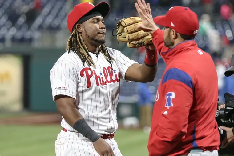Phillies' Maikel Franco celebrates with manager Game Kapler after beating the Tigers 7-3. at Citizens Bank Park in Philadelphia, Wednesday, May 1, 2019  Franco's three run double put them ahead.