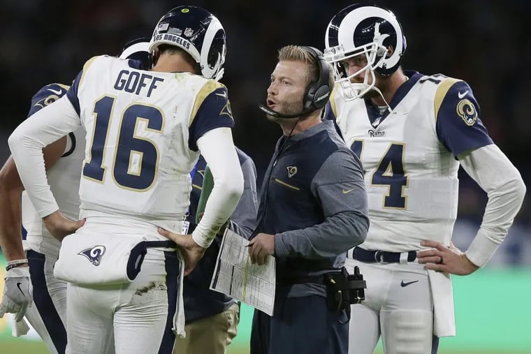 Rams head coach Sean McVay speaks with quarterback Jared Goff in a game against the  Arizona Cardinals.
