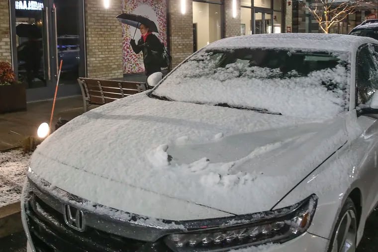 Snow covered cars at the Town Center in King of Prussia on Tuesday. This has been the year of the incremental snows.  STEVEN M. FALK  /  Staff Photographer