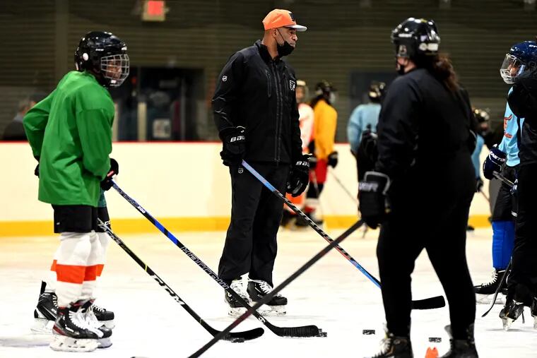 Former Flyers enforcer Donald Brashear was on the ice Wednesday at the Laura Sims Skate House with kids from the Ed Snider Youth Hockey Foundation.
