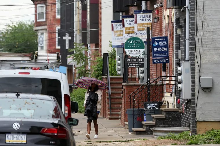 Property management signs advertise student housing for rent on Willington Street near West Oxford Street, a neighborhood adjacent to Temple University, in North Philadelphia on Tuesday, May 14, 2019. Concerns abound over housing costs during the economic devastation wreaked by the coronavirus.