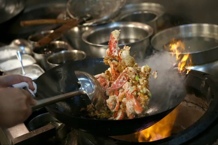 Chef Ming Feng cooks Hong Kong-style lobster with minced pork at China Gourmet in Northeast Philadelphia.