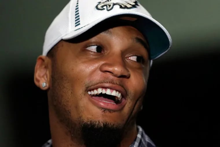 New Eagles safety Patrick Chung speaks with a reporter after an NFL football news conference announcing his three-year deal, Thursday, March 14, 2013, in Philadelphia. (Matt Rourke/AP file)
