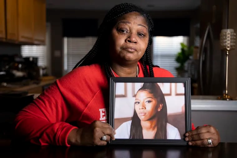 Rhonda Pack Terry holds a portrait of her daughter Ebony, who was gunned down in Lansdale. Prosecutors in Montgomery County are offering a $10,000 reward for information in the case.