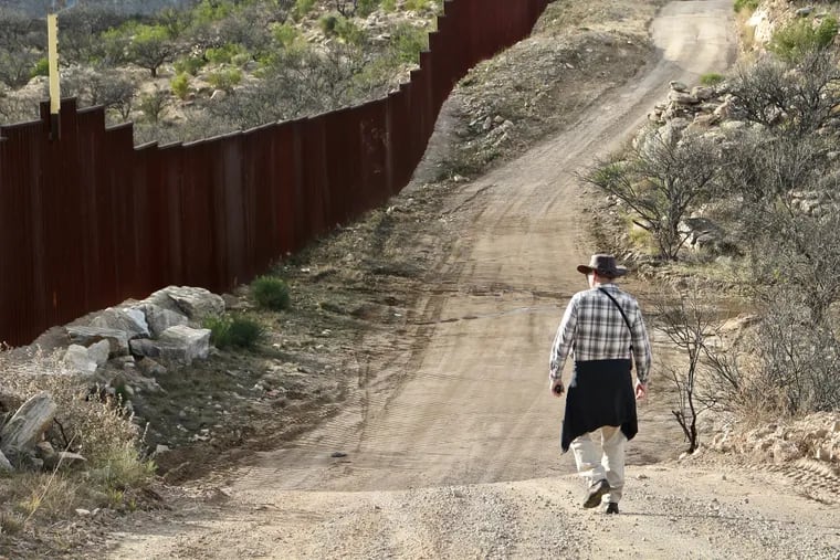 Michael Milne walking along the border in southern Arizona.