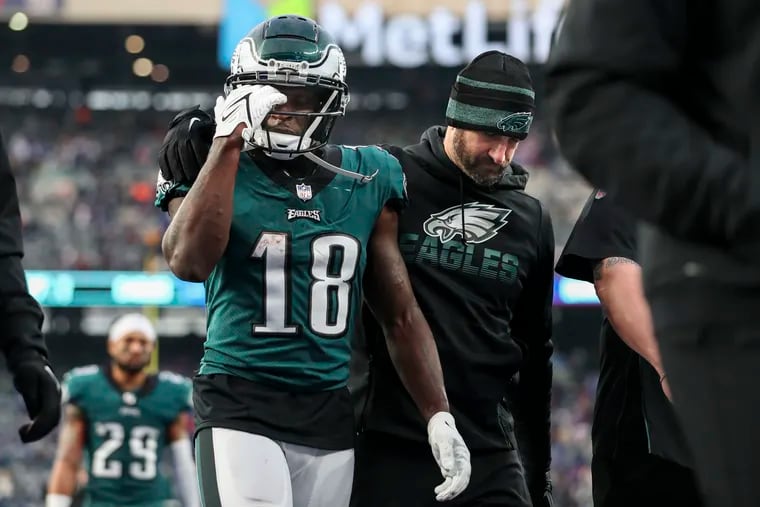 Eagles wide receiver Jalen Reagor (18) and head coach Nick Sirianni leave the field Sunday's 13-7 loss to the New York Giants at MetLife Stadium in East Rutherford, N.J.