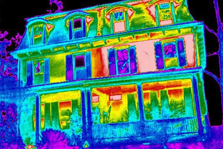 This is a thermal-imaging shot of a Chestnut Hill twin indicating that the home at left is losing less heat. Mark Group, a British firm with offices now at the Navy Yard, is conducting nighttime canvasses. (Mark Group)