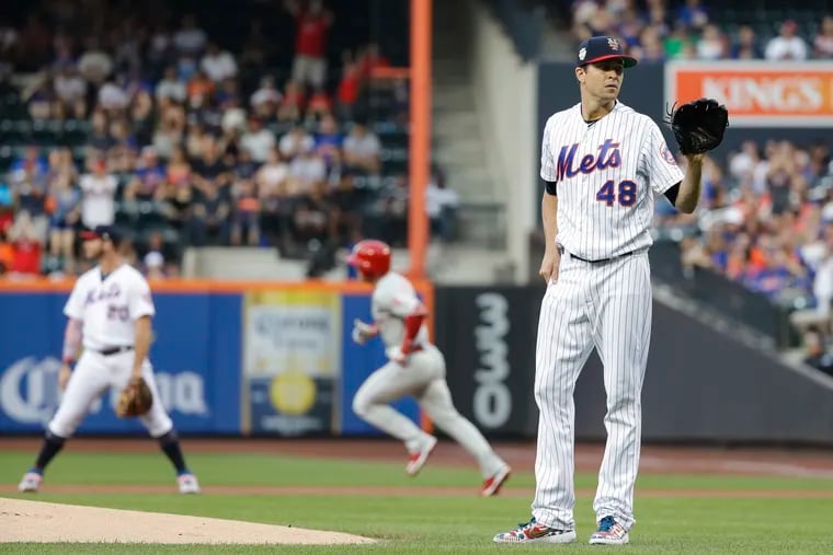 New York Mets starting pitcher Jacob deGrom reacts as Philadelphia Phillies' Scott Kingery runs the bases after hitting a home run during the first inning of a baseball game Friday, July 5, 2019, in New York. (AP Photo/Frank Franklin II)