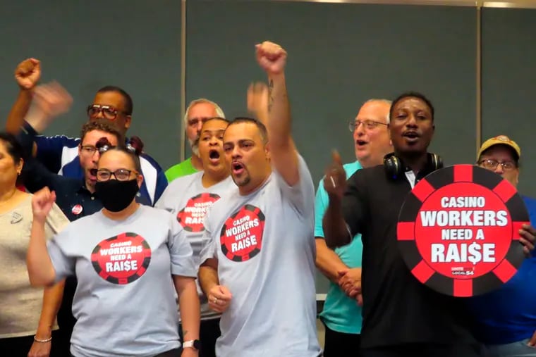 Members of Local 54 of the Unite Here union celebrate after voting on Wednesday, June 15, 2022, in Atlantic City, N.J., to authorize a strike against the casinos next month if a new contract is not reached in two weeks.