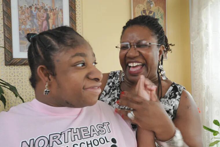 Brittany Stevens and her mom, Harlena Morton, at home in Philadelphia. Morton has hoped for a job for her disabled child. (April Saul / Staff Photographer)