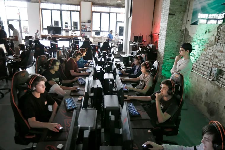 N3rd Street Gamers Griffin Landesberg (far right) keeps a watchful eye on the kids in the e-sports camp at N3rd Street Gamers on July 25.