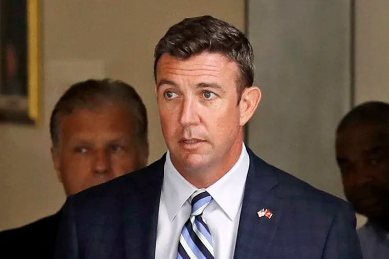 FILE - In this Aug. 23, 2018, file photo, Republican U.S. Rep. Duncan Hunter, R-Calif., leaves an arraignment hearing in San Diego after he and his wife, Margaret, pleaded not guilty to charges they illegally used his campaign account for personal expenses. Federal prosecutors say Hunter illegally used campaign funds to finance romantic flings with a series of women, spending thousands of dollars on meals, drinks and vacations. Allegations about the married Republican congressman's affairs were outlined in a government court filing late Monday, June 24, 2019, connected to charges he and his wife misspent more than $200,000 on trips and personal expenses. (AP Photo/Gregory Bull, File)